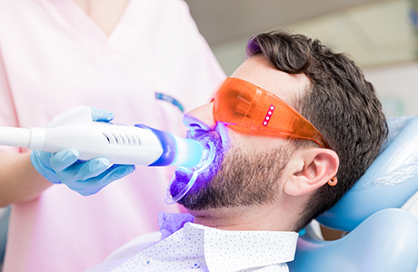 Man receiving a cosmetic dentistry procedure