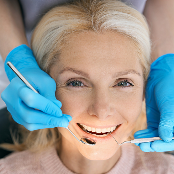 Woman smiling during a dental checkup