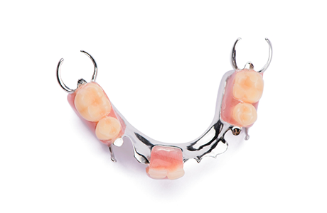 Metal framework with several replacement teeth along it