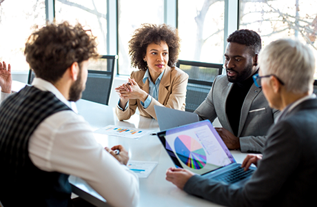Group of office workers having a meeting at a table