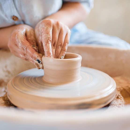 Person doing pottery