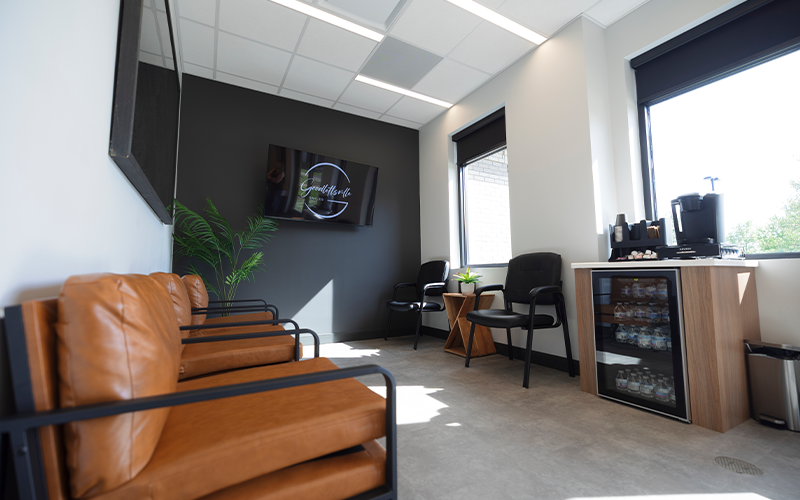 Row of brown leather armchairs in waiting room