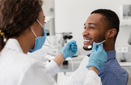 A patient smiling during a dental checkup