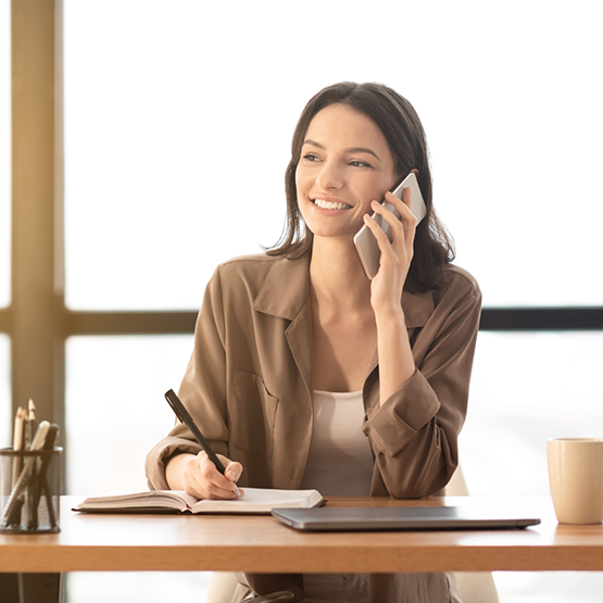 Woman talking on the phone with her BlueCross BlueShield dentist in Goodlettsville