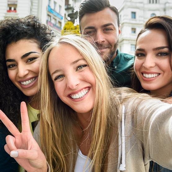 Selfie of four adults smiling after seeing their cosmetic dentist in Goodlettsville