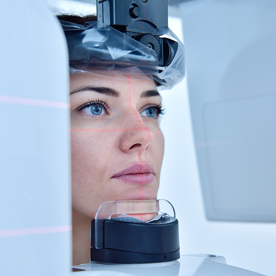 Dental patient having their jaws and mouth scanned with a C T cone beam scanner