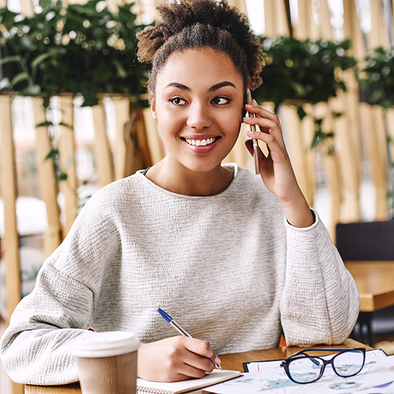 Woman smiling while talking on the phone