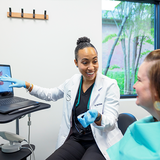 Dentist showing a patient a digital scan of their teeth