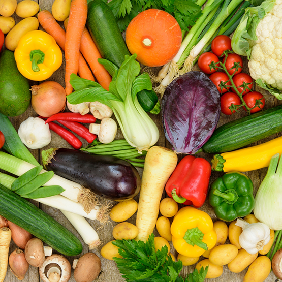 Countertop covered in fresh fruits and vegetables